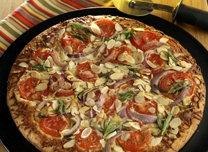 Slivered almonds add crunch to a quick pizza.