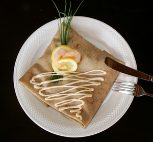 Tender shrimp and a spinach seafood sauce in a buckwheat crepe at Beau Monde.