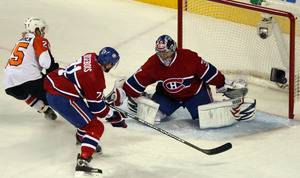 Flyers' Patrick Thoresen watches R.J. Umberger's first-period goal get past Montreal goalie Carey Price and Patrice Brisebois.