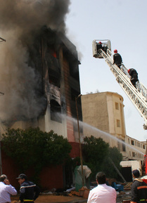 Firefighters battle a blaze that killed 55 at a mattress factory in Casablanca, Morocco.