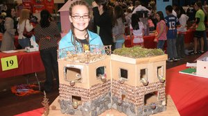 Fifth grader Sabrina Fineberg, with the house she built for the "Build a House, Build a Dream" contest. Fineberg earned second place.