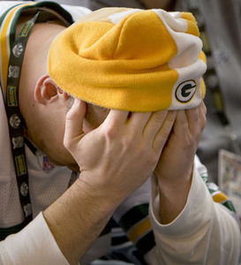 Packers fan Ben Wescott can only hold his head in his hands after Green Bay traded away its first-round pick.