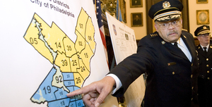 Police Commissioner Charles Ramsey illustrates his crime initiative at a headquarters press conference yesterday.