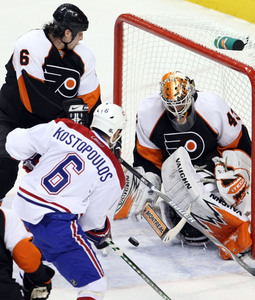 Flyers goalie Marty Biron thwarts Tom Kostopoulos in Game 4 as Randy Jones defends. "Biron has been on top of his game right now," Montreal coach Guy Carbonneau says.