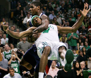 Atlanta Hawks forward Marvin Williams throws Boston Celtics guard Rajon Rondo in the third quarter of teams' playoff game. Williams was ejected for the flagrant foul. Rondo returned.