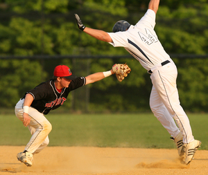 Germantown Academy's Tom Coyle reaches to tag Malvern Prep's Nick Busillo during second-inning steal attempt.