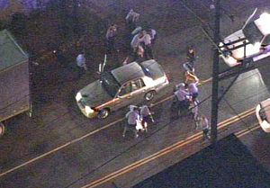 Footage from a news helicopter shows Philadelphia Police officers beating three suspects on North 2nd Street near Lippincott in Hunting Park late Monday night.