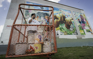 Efrain Herrera does and doesn't need a lift. He could use some help to do his mural artistry on this wall at York and American, in North Philly, and he's calling to get more fuel for the machine. The work, "Blueprint for a Better Philadelphia," though, is fairly uplifting on its own.
