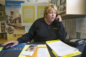Another call: Donna Turner of AHOME in Millville, N.J., counsels one of an increasing number of clients fearing foreclosure.