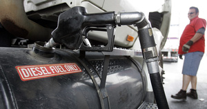 Trucker Randal Line of Allentown fills his semi with diesel fuel in Harrisburg. Oil closed yesterday at $121.84 a barrel. Last year, it was about $62.