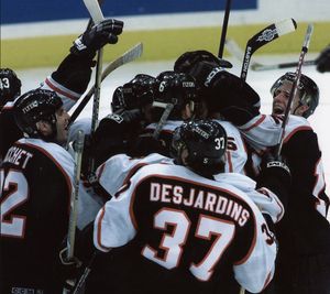 Teammates mob Keith Primeau after his goal in the fifth overtime at Pittsburgh on May 4, 2000.