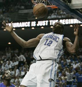 Magic's Dwight Howard dunks in last night's game against Pistons.