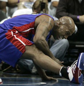 Chauncey Billups, the all-star point guard, falls with a strained right hamstring after getting tangled up with Orlando's Jameer Nelson.