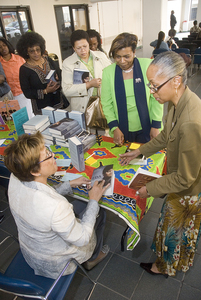 Author Paula J. Giddings signs her book "Ida: A Sword Among Lions" for Dianna Taylor yesterday at the Daily News, for an event sponsored by the People Paper and the African American Children's Book Project.