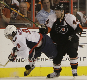 Kimmo Timonen, the Flyers' best two-way defenseman, handles Caps star Alexander Ovechkin. He's likely to miss the rest of the playoffs.