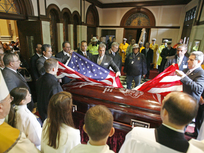 A flag is draped over Sgt. Stephen Liczbinski’s casket. “Killed in the line of duty — those are the six words we never hope to hear,” said Commissioner Charles Ramsey. (Michael S. Wirtz / Inquirer)