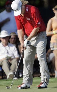 Charley Hoffman putts with an iron on the 15th green at the Players Championship. He had tossed his putter into a lakeon the 13th hole after missing a 20-inch putt.