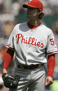 The Phils' Jamie Moyer waits for Aaron Rowand to round the bases on a solo shot in the 2d.