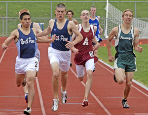 A close finish in the boys' 800 includes (from left) North Penn's Zack Montijo and Steve Franks, who finished 1-2, respectively; Abington's Kyle Moran, and Pennridge's Mike Musiowski.