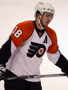 Mike Richards skates back to bench after Pens' empty-net goal.