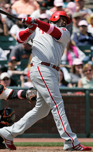 Ryan Howard hits a rare triple to drive in Chase Utley in the fifth inning at AT&T Park.