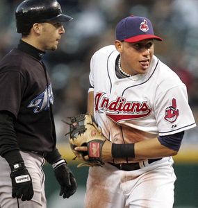 CHUCK CROW / The Plain Dealer (Ohio) Second baseman Asdrubal Cabrera completes a triple play after tagging the Blue Jays' Marco Scutaro in the fifth inning, a record third time an Indians fielder has done so.