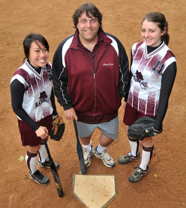 "Quit? No, I never felt like quitting at all," said pitcher Tammy Do (left), joined by coach Joe Long and infielder Karen Boyle.