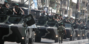 Lebanese troops atop armored personnel carriers patrol in Tripoli. The army expanded its deployment to several areas yesterday.