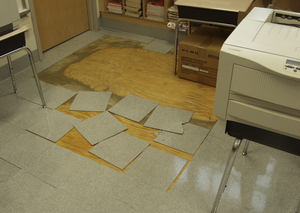 An inspection by Controller Alan Butkovitz's office listed these broken and missing floor tiles at McDaniel Elementary School as a tripping hazard.