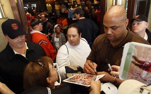 Charles Barkley signs autographs at a charity golf tournament in suburban Birmingham, Ala.