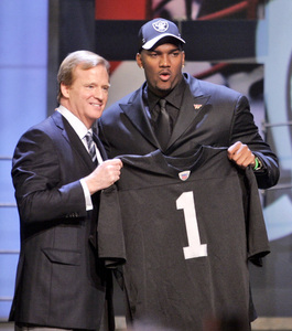 JaMarcus Russell, the top pick in 2007 NFL draft, is given jersey by commissioner Roger Goodell.