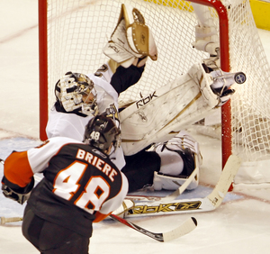 Daniel Briere, put on line with Mike Richards, puts shot on Penguins goalie Marc-Andre Fleury.