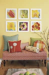 Digital images of flowers, blown up and printed on canvas, can be bright artwork on a wall that is painted a neutral color.