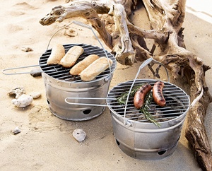 At the park, on the beach, even on the deck, this bucket-style Portable BBQ Grill ($39) means tasty cookouts. Available at area Pottery Barn stores and www.potterybarn.com.