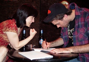 Mathilda McCommon stars as Gina, host of "The Dead Guy," and Nathan Holt plays the contestant, Eldon, in the Flashpoint Theatre production.