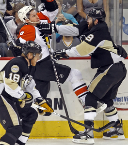 Flyers' Scottie Upshall hits roadblock by Pens' Pascal Dupuis.