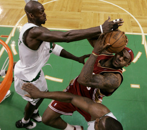 Kevin Garnett swats a shot back at LeBron James.