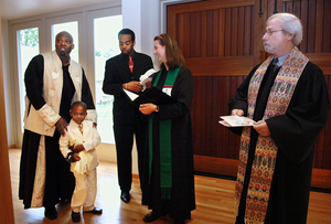 At the United Church of Christ at Valley Forge in Wayne, (from left) the Rev. Derick B. Wilson, his son Xavier, 4, and youth minister Maurice Robinson of Healing Stream prepare for services with the Rev. Frances Chester and the Rev. Frank Pennington.