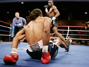 Chris Byrd, who dropped from heavyweight to light heavyweight, is knocked to the canvas by Shaun George in Friday night's bout.