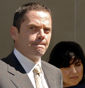 Donald J. "Gus" Dougherty Jr. with his wife, Dana, after pleading guilty. He now might not be called to testify in the probe of John J. Dougherty.