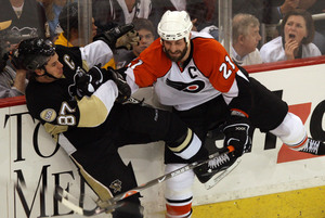 Injured shoulders didn't prevent Jason Smith from checking Pens' Sidney Crosby.