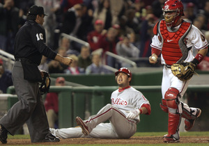 Greg Dobbs is out at plate trying to score on a ninth-inning double. Catcher is Jesus Flores.