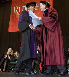 The former Penn State cornerback receives his law-school diploma from Dean Rayman L. Solomon.