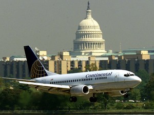 A jet approaches near Washington. "The industry faces its worst crisis since 9/11," Continental said. It will cut capacity 11%.