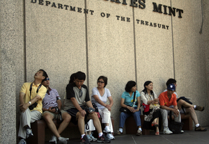 "Camera sitters" waiting outside the U.S. Mint because it doesn't permit cameras inside. What's it afraid of: That tourists might take photos of coins?