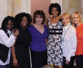 Strong yet feminine: Michelle Obama with "The View" gang on Wednesday. By simply being one half of America's potential first couple, she may change our country's image and set fashion trends.