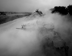 U.S. Marines from the 24th Marine Expeditionary Force return fire on Taliban positions near Garmser, Helmand province.