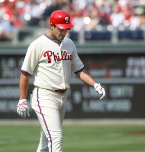 Pat Burrell walks back to dugout after lining out in eighth inning.