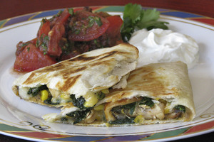 Chicken and corn quesadillas - with leafy salad - make for a quick and easy meal.