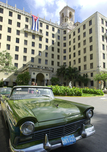 Outside of Havana's Hotel Nacional, a vintage taxi symbolizes the decades since the U.S. had normal relations with Cuba.